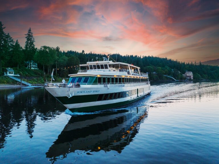 Portland Spirit tour boat for day cruises on the Columbia River shown at sunset